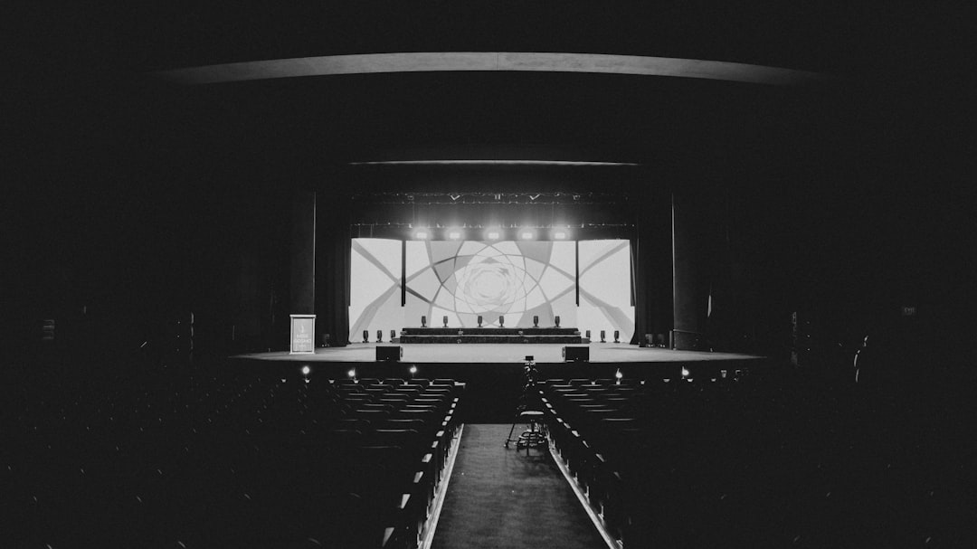 A stage performance lit up in a dark theater